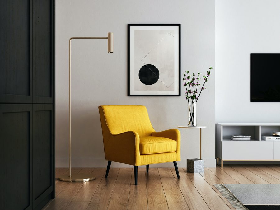 Two people talking across a table in a bright room