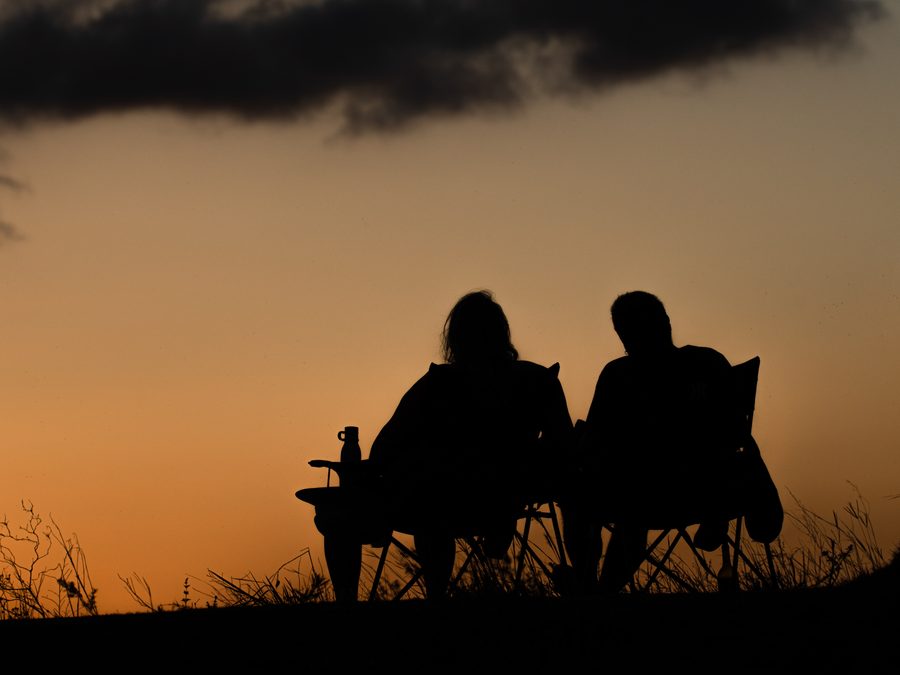 Two people sitting side by side in conversation
